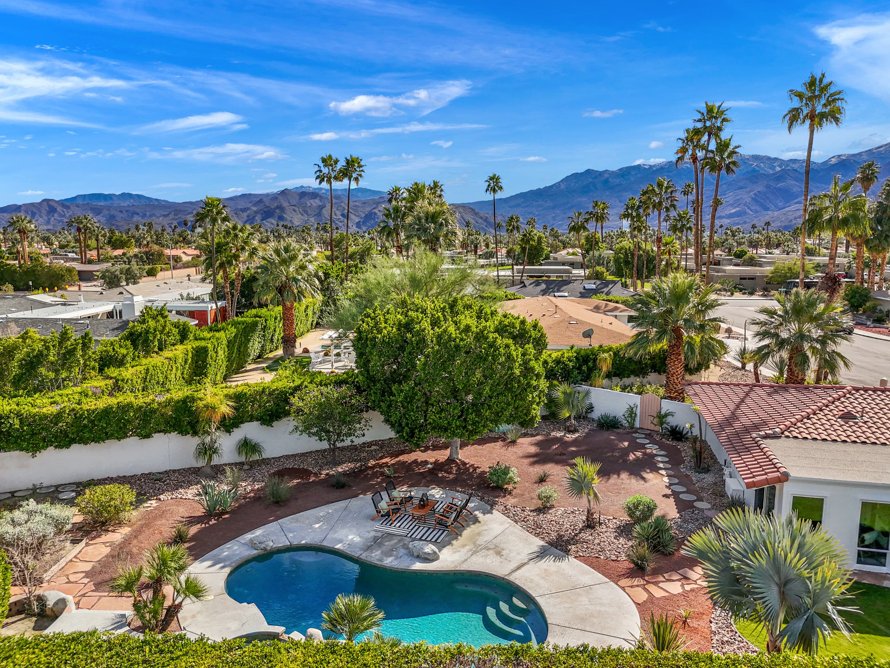 Aerial over the pool against the San Jacinto panorama