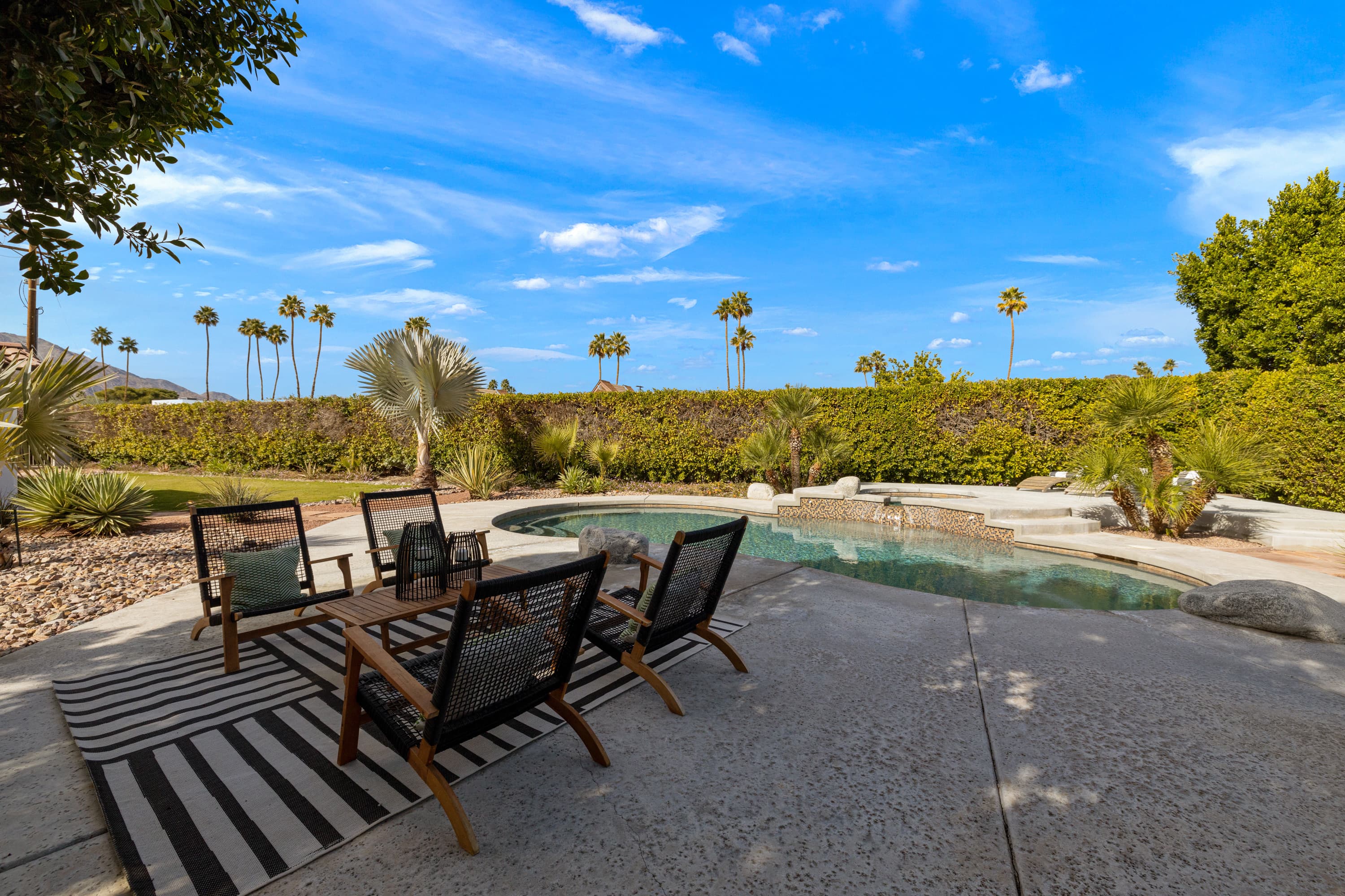 Fire pit lounge beside the pool