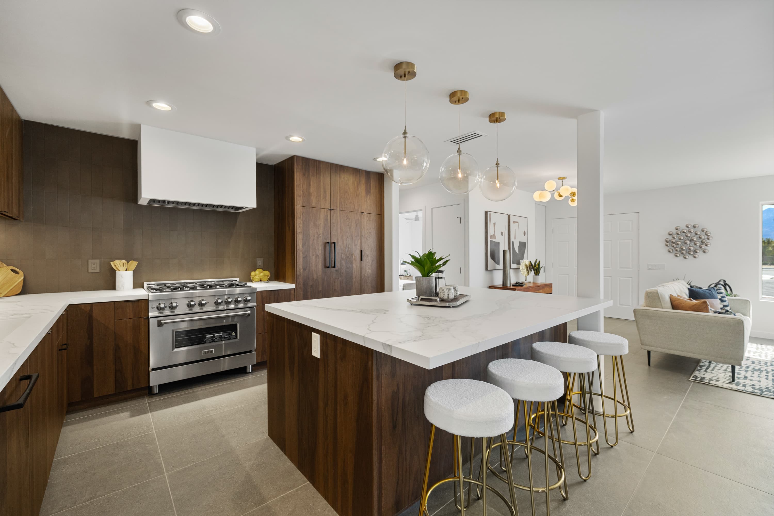 Walnut kitchen with glass pendants