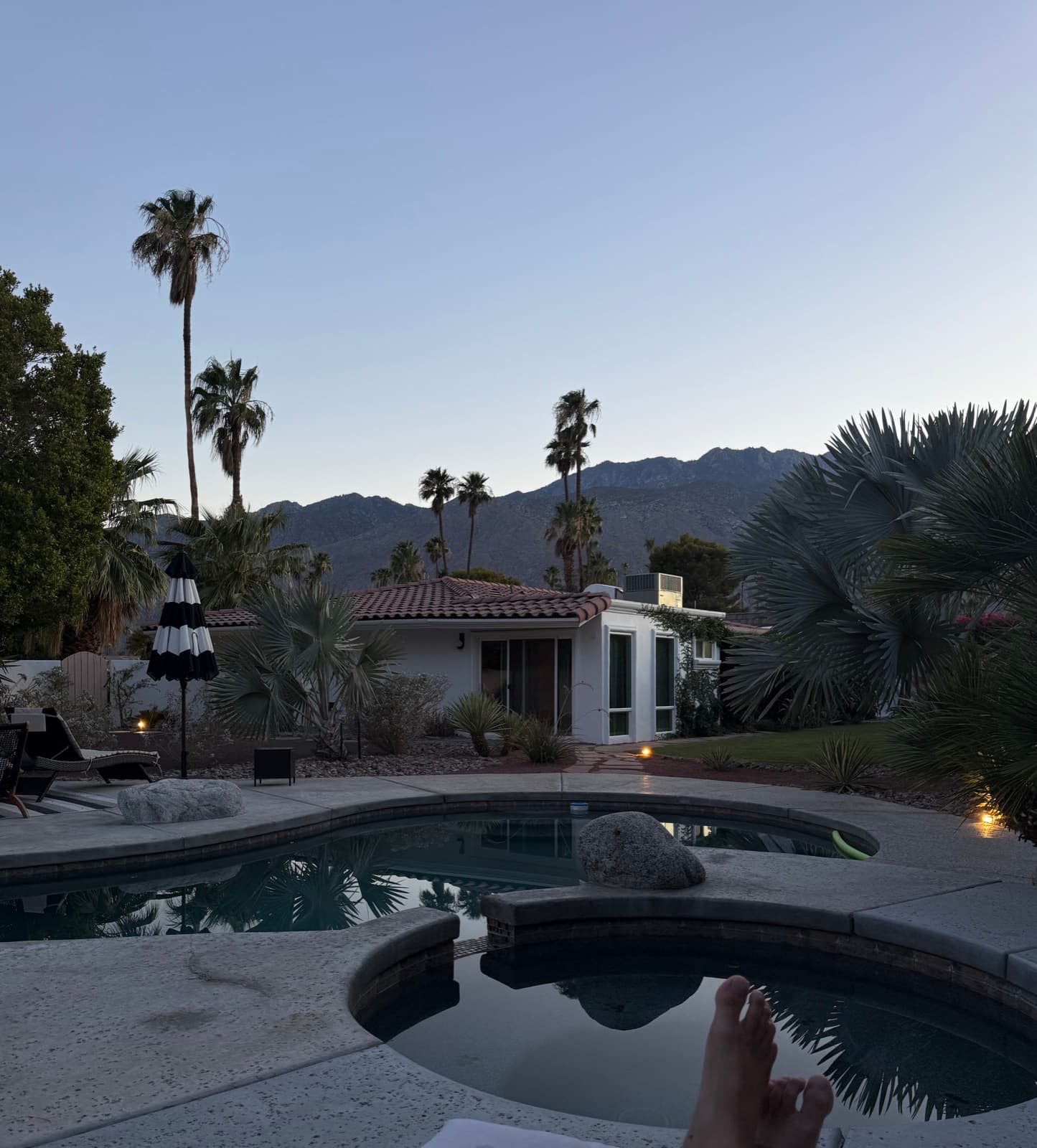 Feet up in the hot tub at blue hour